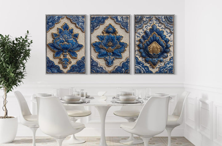 Set of three blue and gold azulejo tile canvas prints displayed above a modern white dining set.