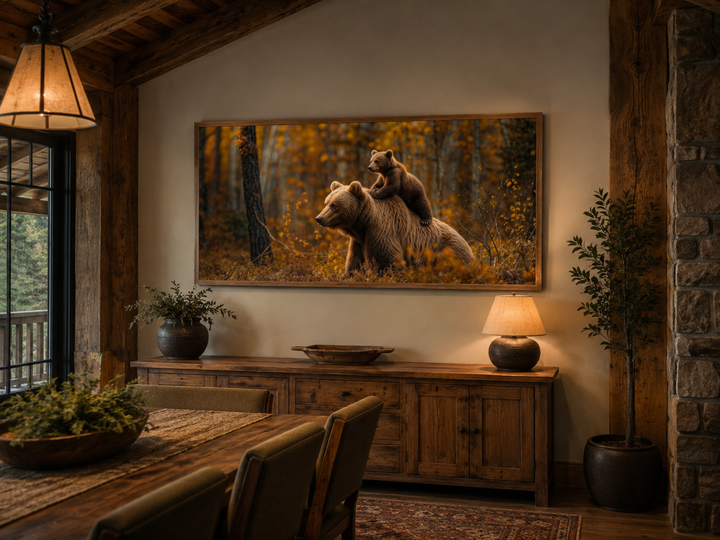 Framed canvas wall art of a baby bear riding a mama bear in an autumn forest for cabin decor.