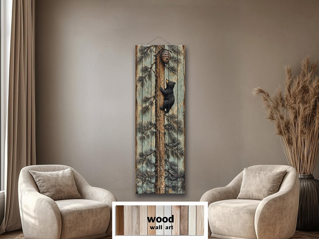 Rustic wood plank wall art of a baby bear climbing a pine tree towards a beehive in a cozy room.