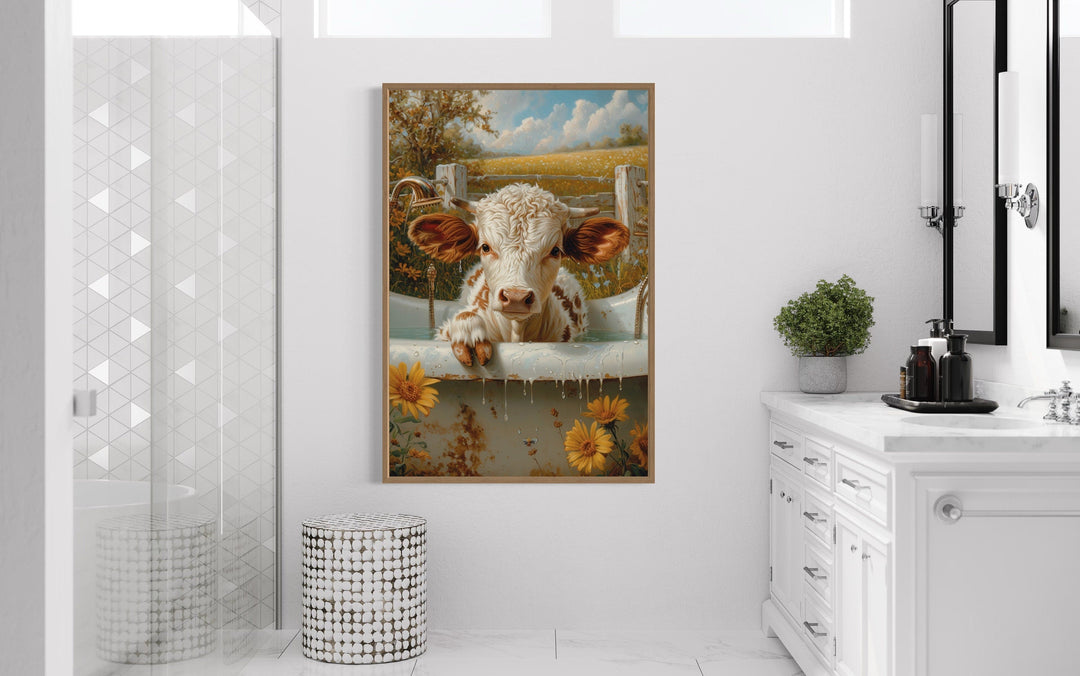Framed canvas wall art of a baby highland cow calf in a bathtub.