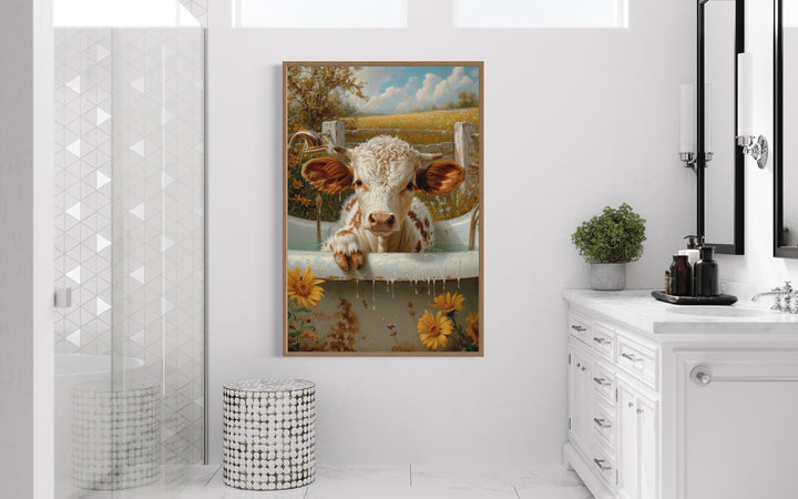 Framed canvas wall art of a baby highland cow calf in a bathtub.