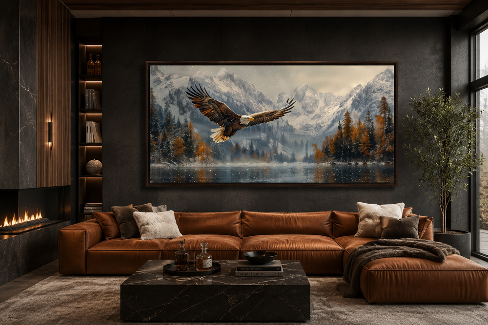 Framed wall art of a bald eagle flying over a snowy mountain lake in a modern living room.