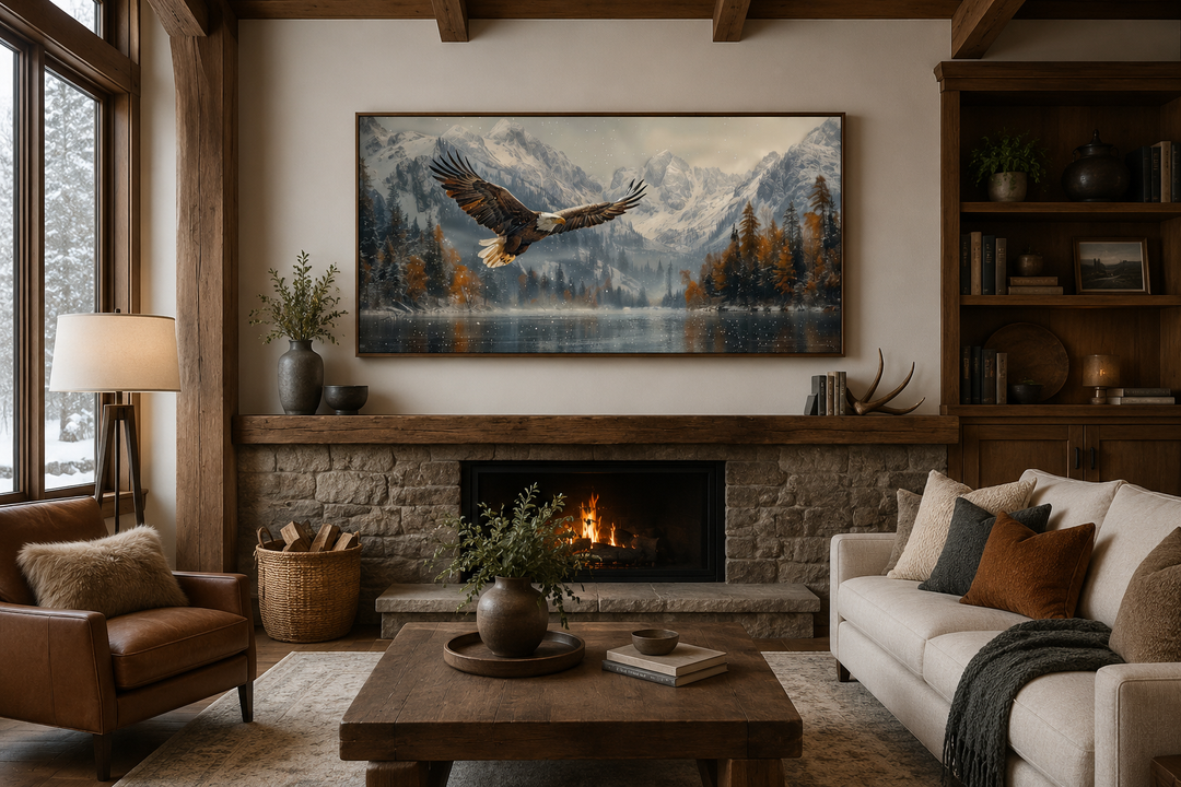 Framed wall art of a bald eagle flying over a snowy mountain lake above a stone fireplace.
