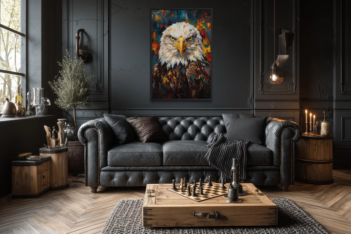 Bald eagle canvas wall art in a dark office with a black leather sofa and wooden coffee table.