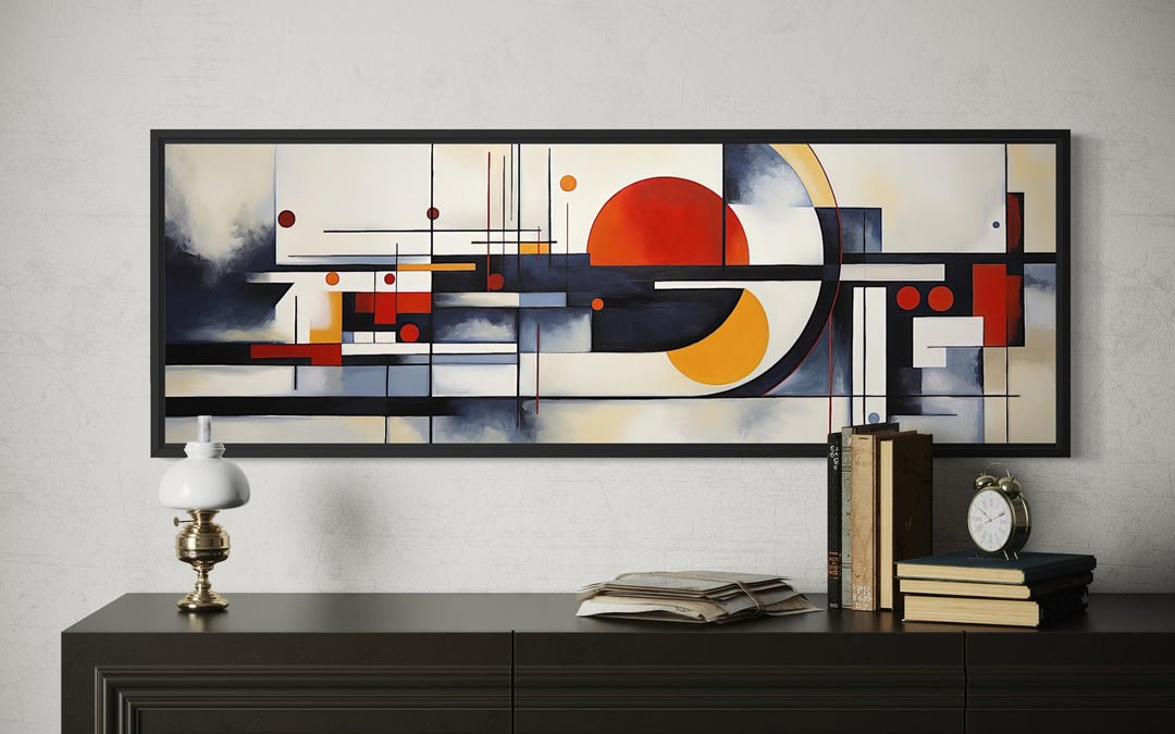 Bauhaus abstract geometric canvas print in a panoramic frame above a dark wood console.