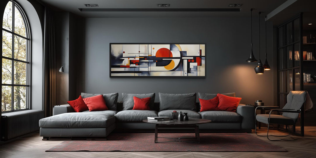 Bauhaus abstract geometric canvas print in a panoramic format above a modern grey sofa.