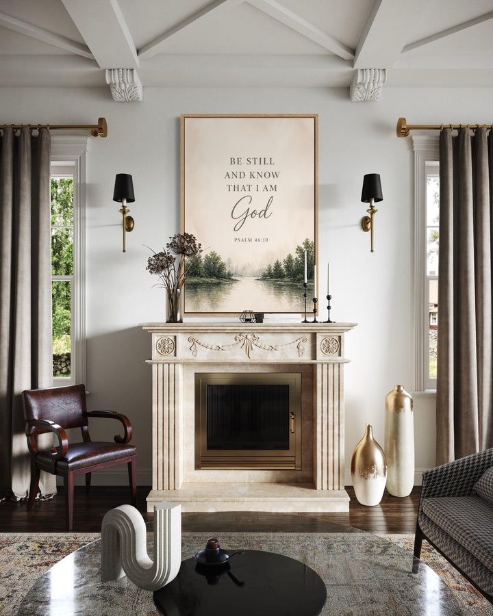 Be Still and Know That I Am God scripture wall art above a fireplace in a neutral living room.