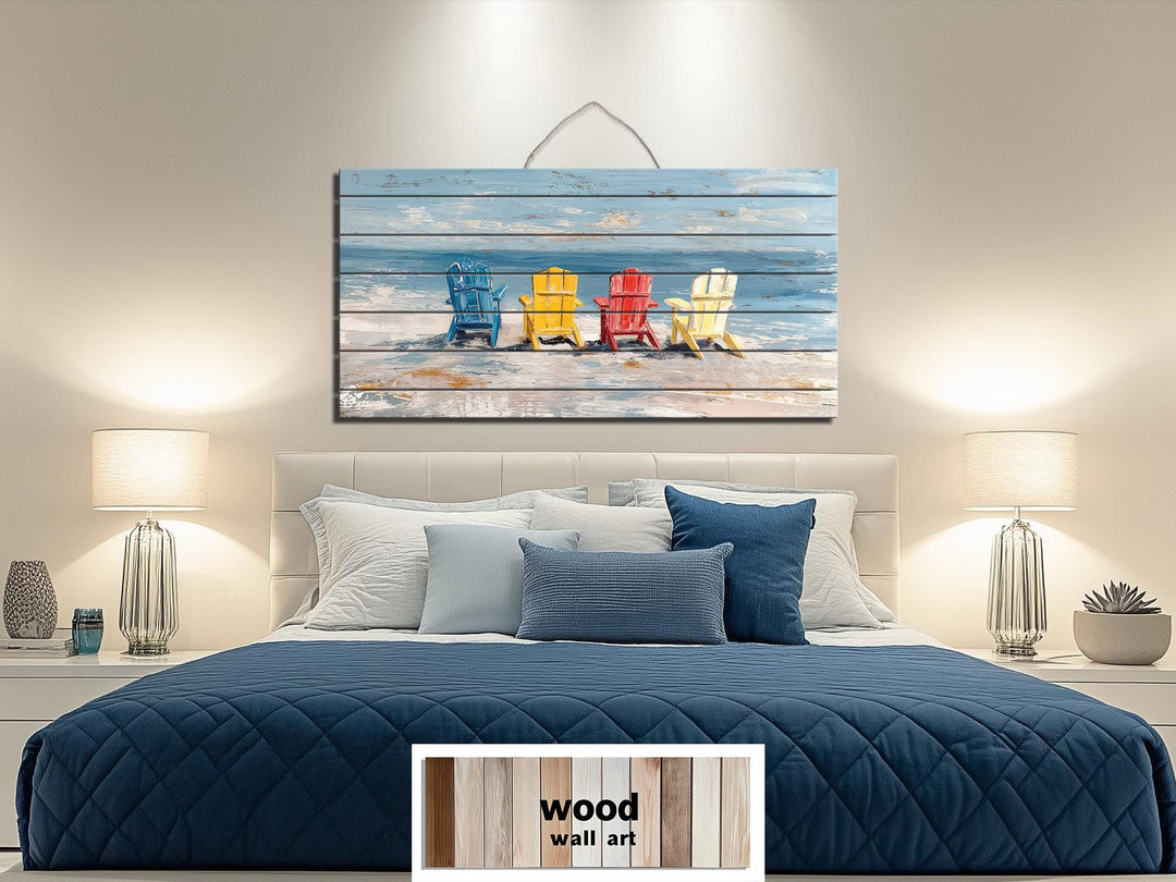 Colorful Adirondack beach chairs printed on a rustic wood wall art panel above a bed.