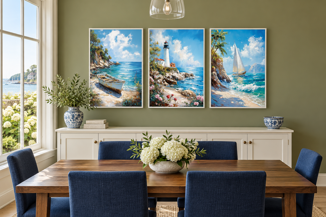 Set of 3 framed canvas wall art featuring a lighthouse, sailboat, and old boat in a dining room.