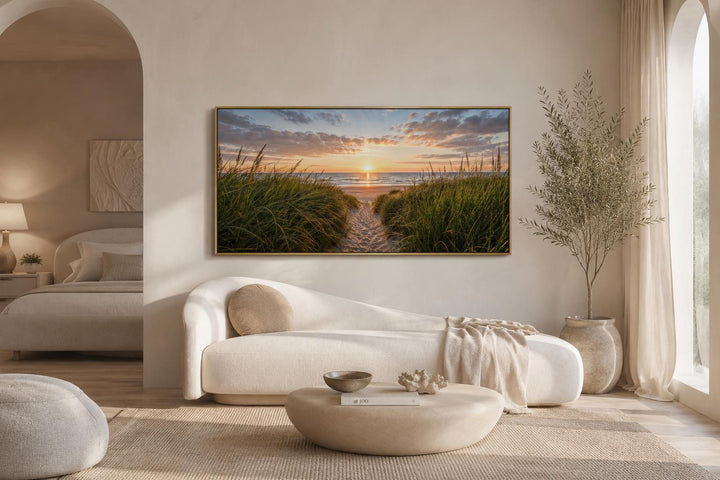 Beach Sunset, Grass And Sand Dunes Coastal Canvas Wall Art in a wide horizontal frame above a sofa.