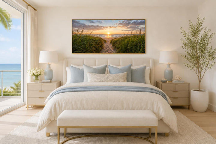 Beach Sunset, Grass And Sand Dunes Coastal Canvas Wall Art hanging above a bed in a neutral room.