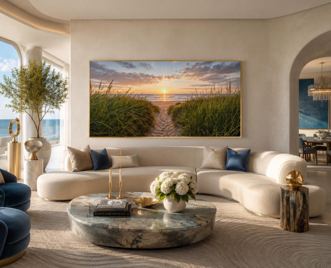 Beach Sunset, Grass And Sand Dunes Coastal Canvas Wall Art hanging above a curved sofa.