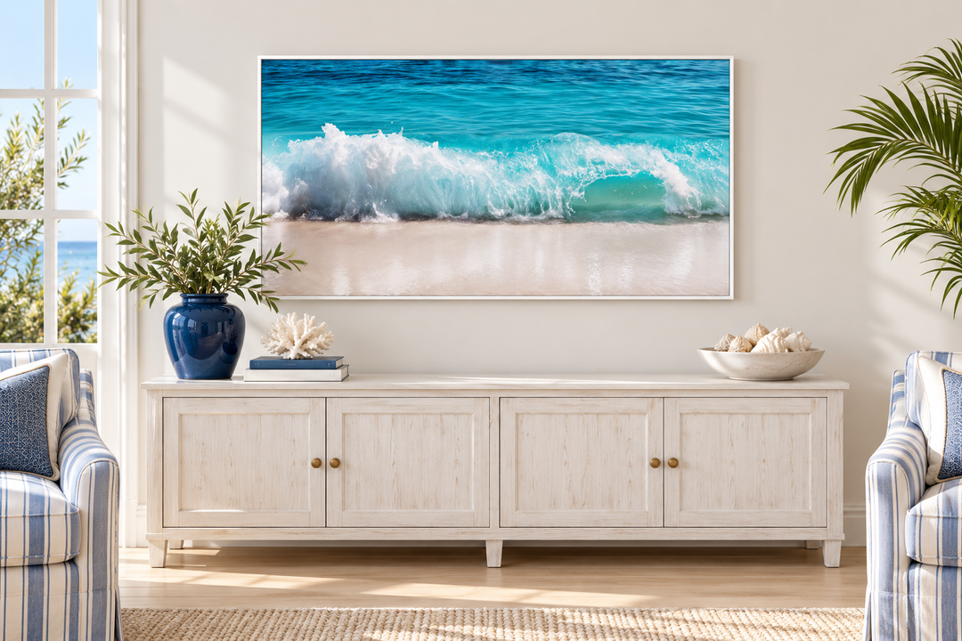 Ocean wave photography coastal framed canvas wall art above a white sideboard in a living room.