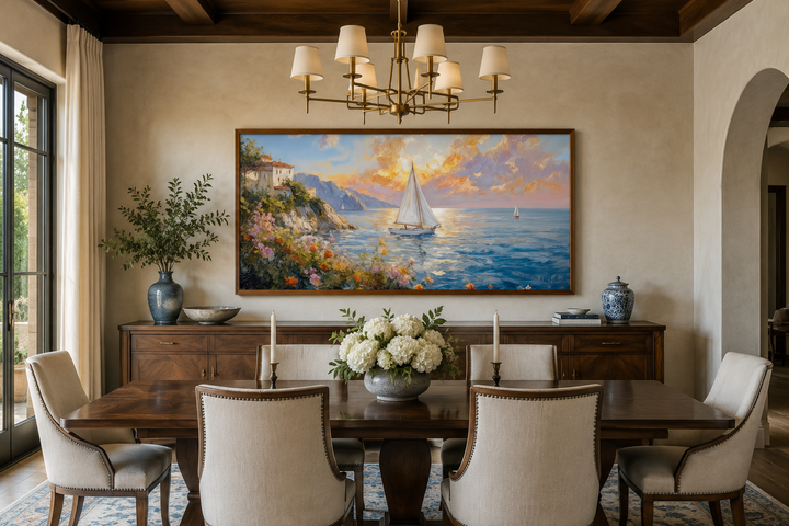 Modern coastal framed canvas print of a sunset seascape with sailboats in a dining room setting.