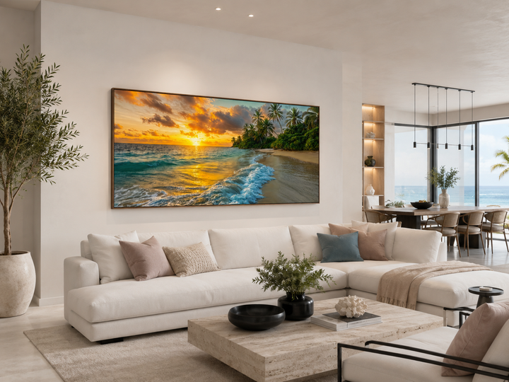Tropical Beach At Sunset Framed Canvas Wall Art displayed above a white sofa in a modern living room