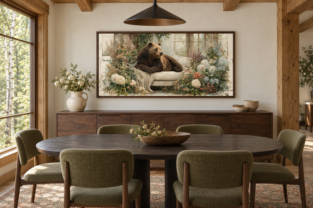 Bear on Couch Floral Canvas Wall Art in a walnut frame above a wooden sideboard in a dining room.