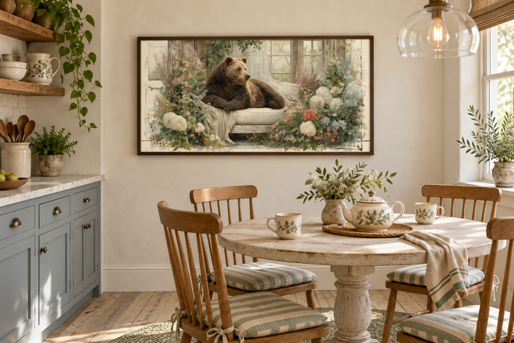 Bear on Couch Floral Canvas Wall Art in a walnut frame above a farmhouse breakfast nook table.