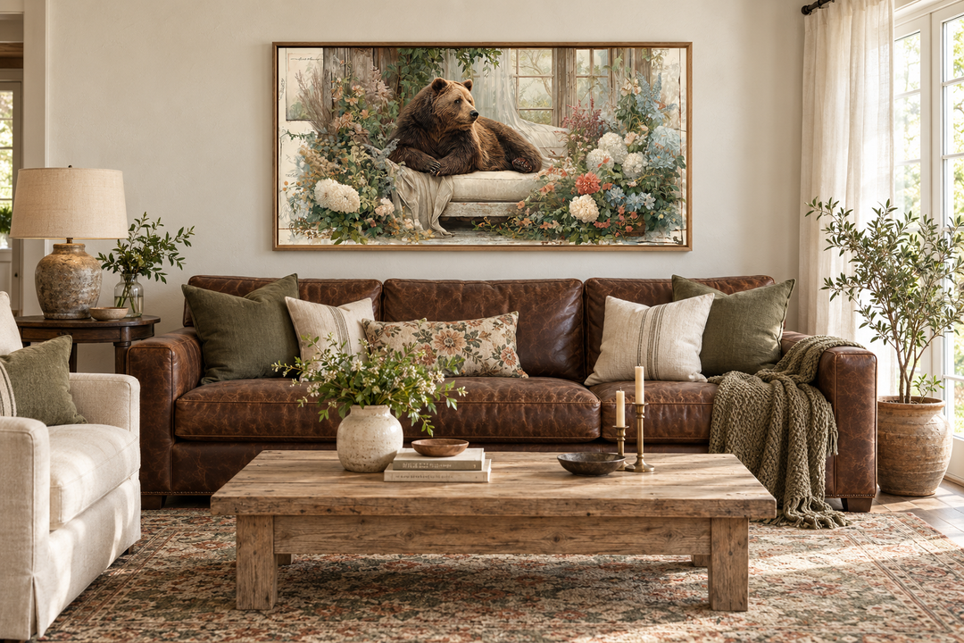 Bear on Couch Floral Canvas Wall Art in a rustic living room with a brown leather sofa.