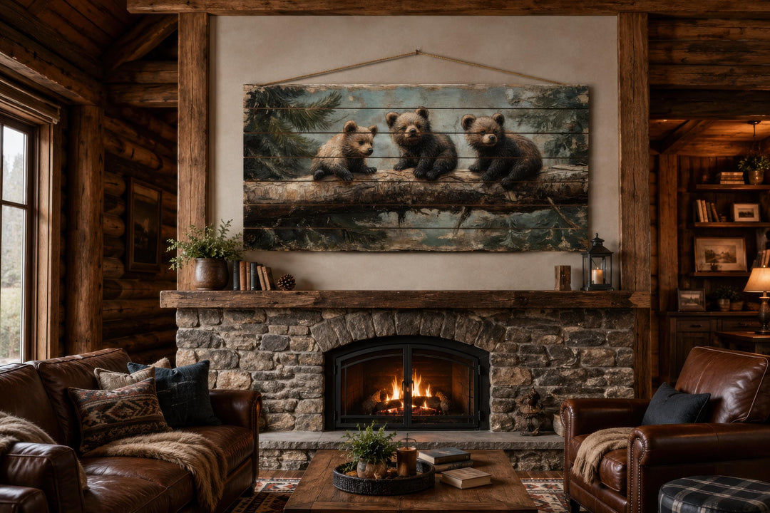 Bear Cubs Wood Art on a distressed wood panel print hanging above a rustic stone fireplace.