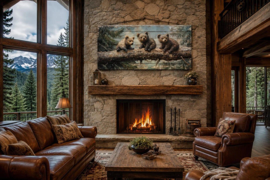 Bear Cubs Wood Art on a stone fireplace in a rustic cabin living room with leather sofas.