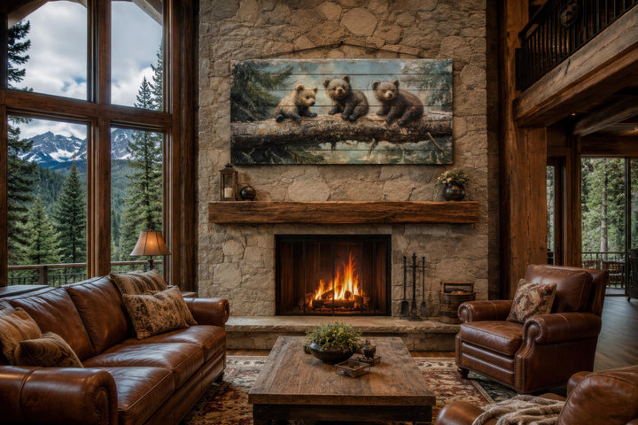 Bear Cubs Wood Art on a stone fireplace in a rustic cabin living room with leather sofas.