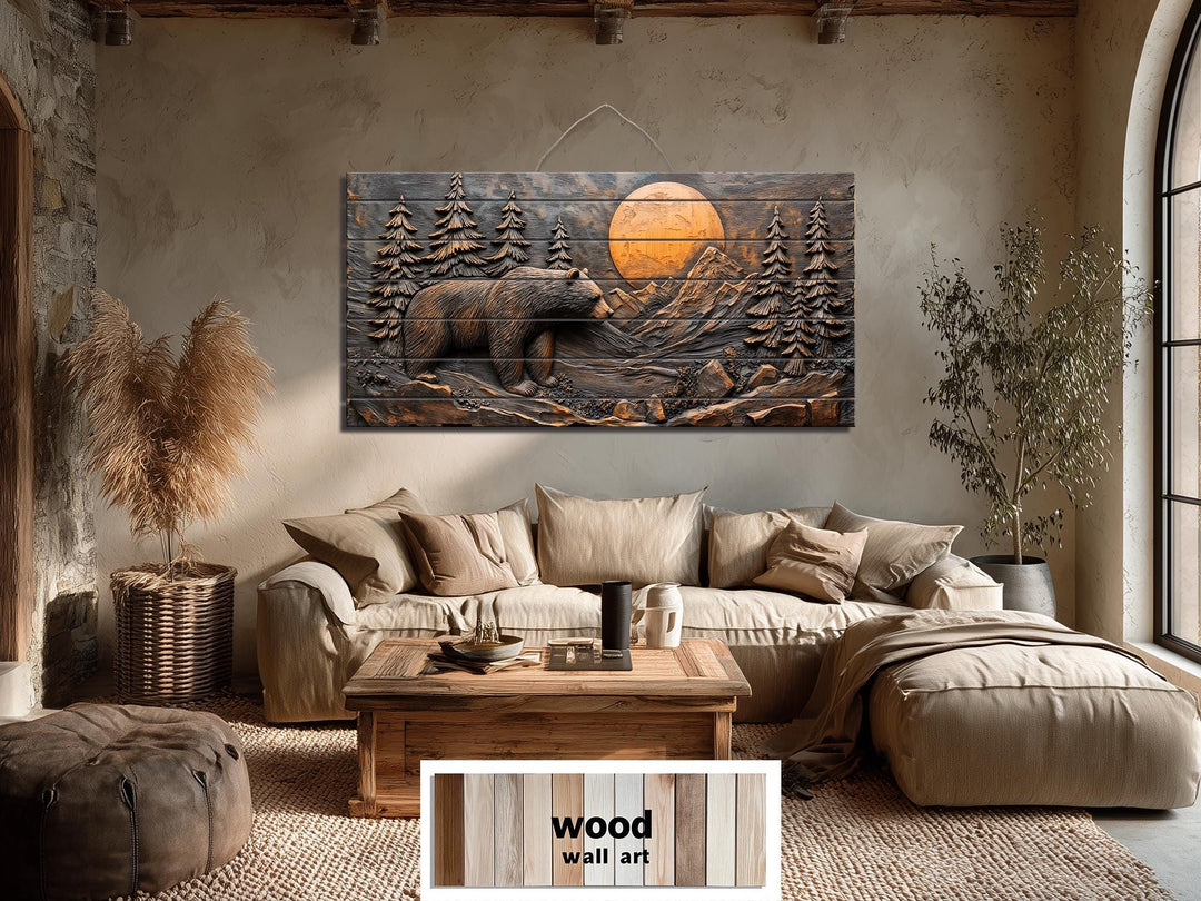 Rustic wood wall art featuring a carved bear and mountain scene at sunset above a living room sofa.