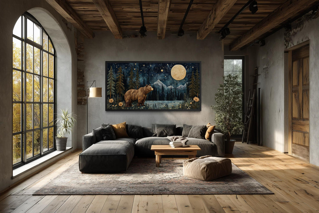 Bear in night forest wall art canvas print with full moon and mountain landscape in a rustic room.