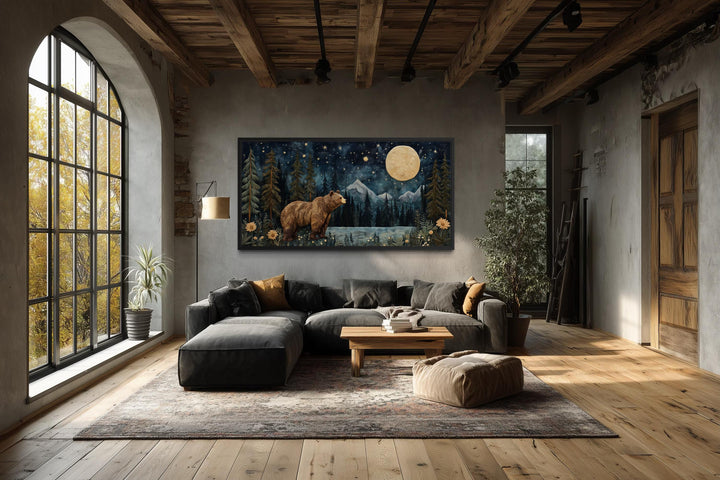 Bear in night forest wall art canvas print with full moon and mountain landscape in a rustic room.