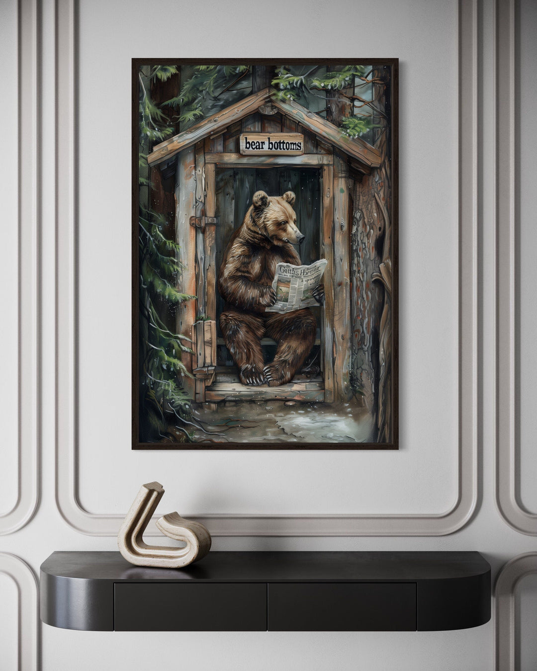 Bear in outhouse reading newspaper in forest cabin picture.
