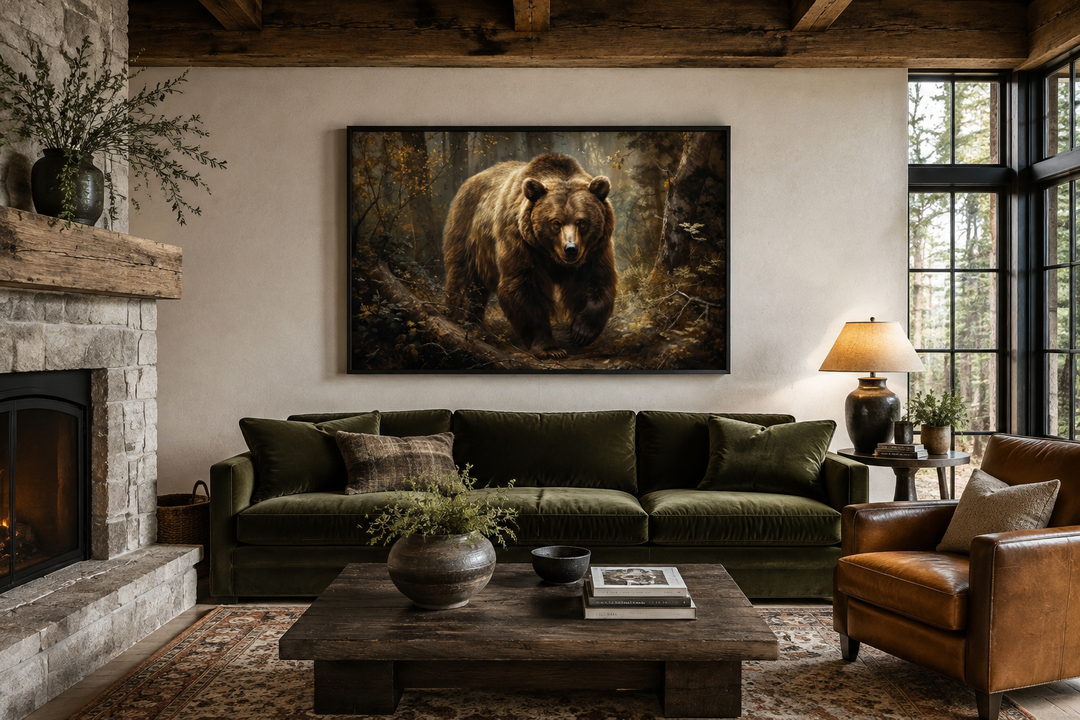 Bear in the forest framed canvas wall art hanging above a green sofa in a rustic cabin living room.