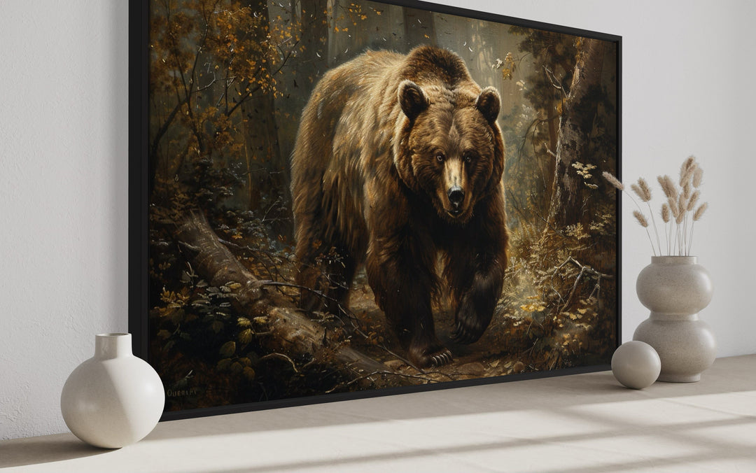 Framed canvas wall art of a brown bear in a forest, displayed with modern vases.