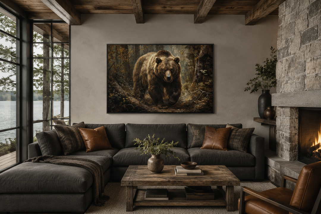 Bear in the forest framed canvas wall art hanging above a dark grey sofa in a rustic living room.