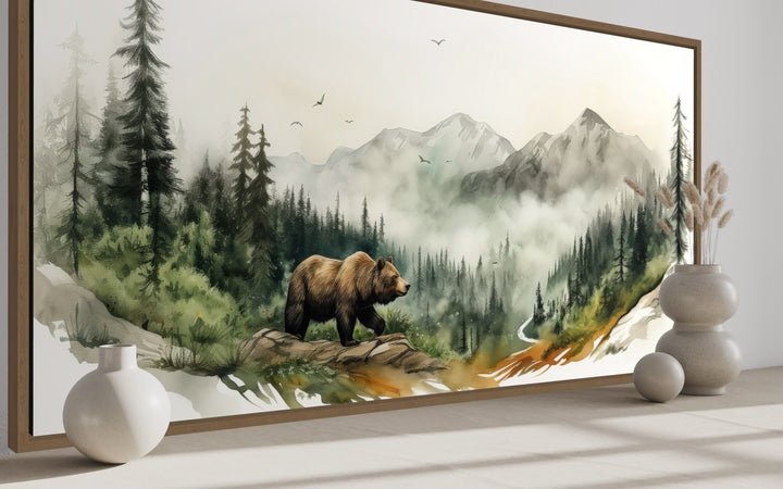 Watercolor wall art of a bear in a misty mountain forest with rustic cabin wildlife decor.