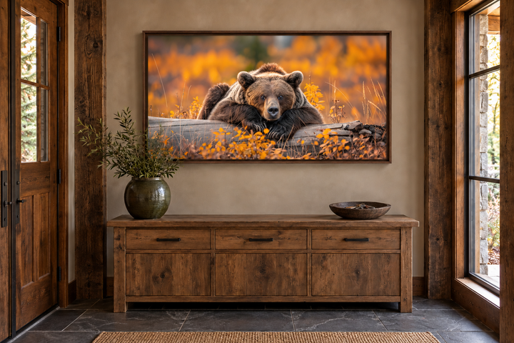 Grizzly bear on a log wall art in a rustic cabin entryway with autumn forest colors.