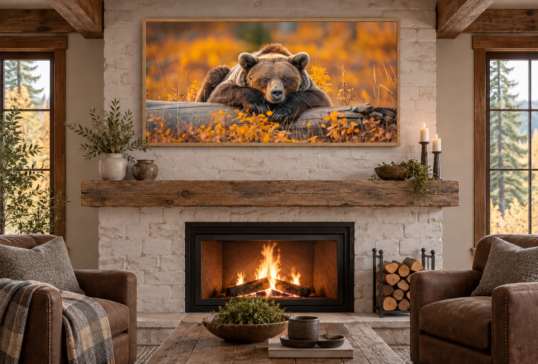 Grizzly bear on a log wall art in a rustic cabin living room above a stone fireplace.