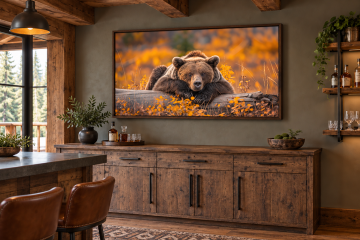 Grizzly bear on a log wall art in a rustic cabin setting with autumn forest colors.