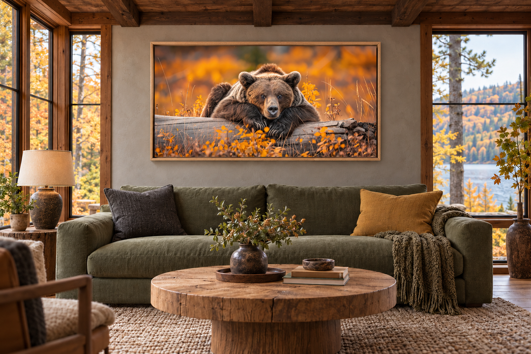 Grizzly bear on a log wall art in a rustic cabin living room with autumn forest colors.