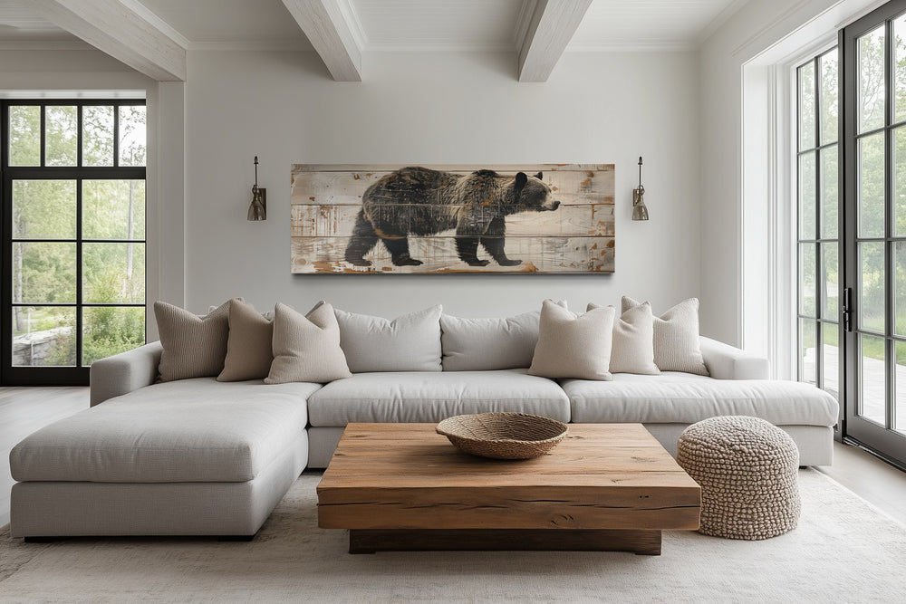 Bear painted on wood long horizontal framed canvas wall art above a sofa in a rustic living room.