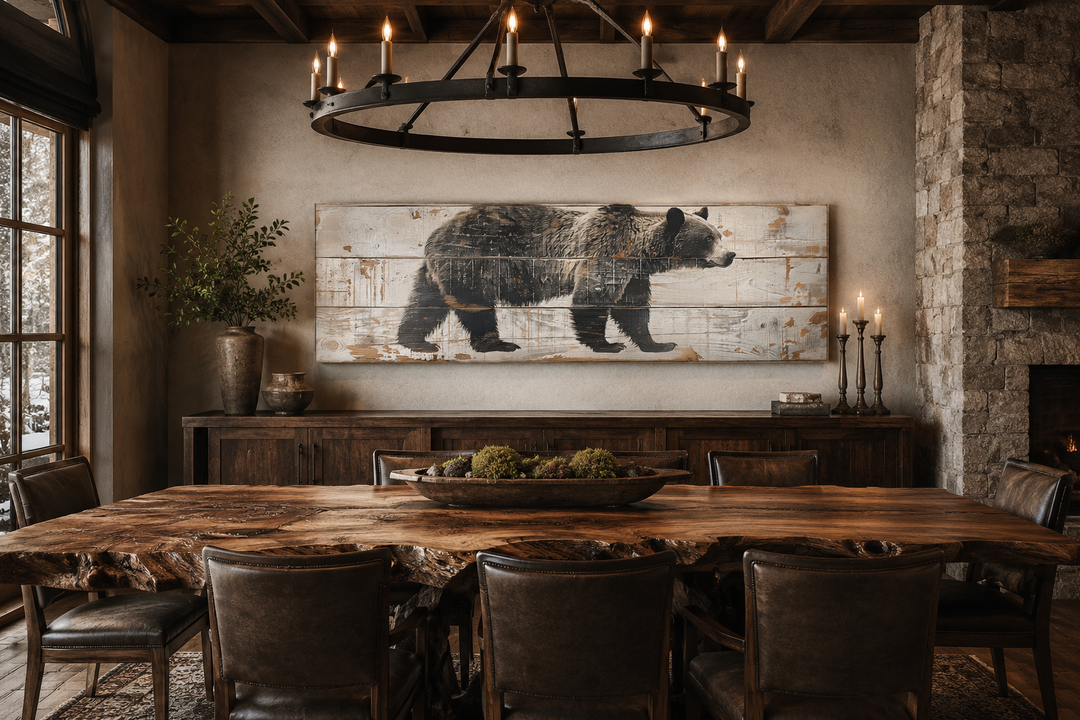 Long horizontal framed canvas wall art of a bear painted on wood, hanging in a rustic dining room.