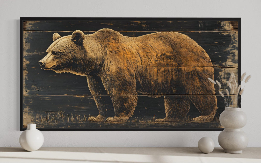 Framed canvas wall art featuring a detailed bear painted on a dark wood plank background.