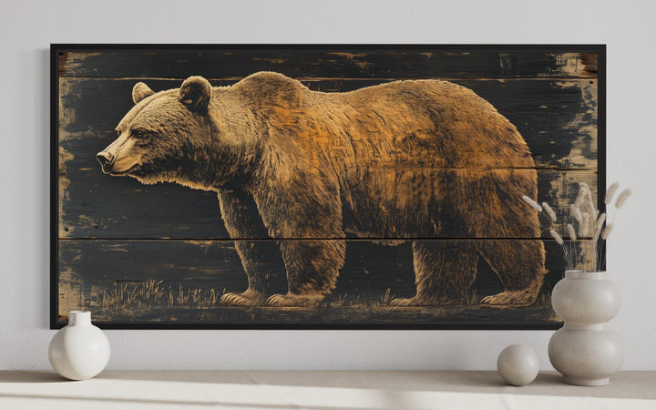 Framed canvas wall art featuring a detailed bear painted on a dark wood plank background.