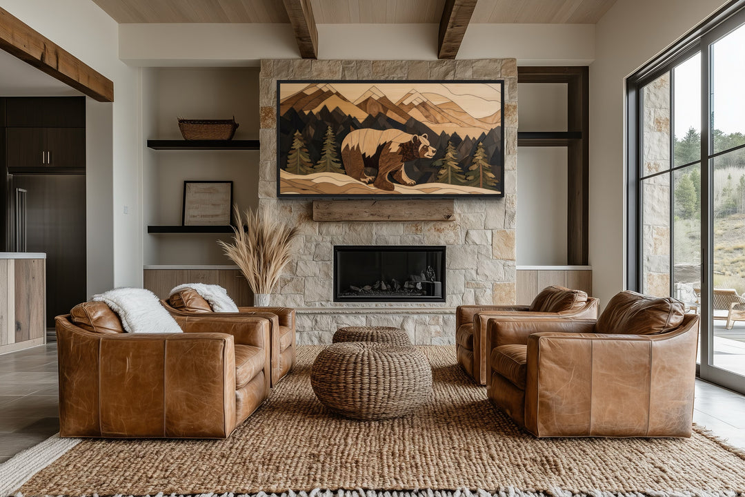 Bear painting on wood canvas wall art above a stone fireplace in a rustic living room.
