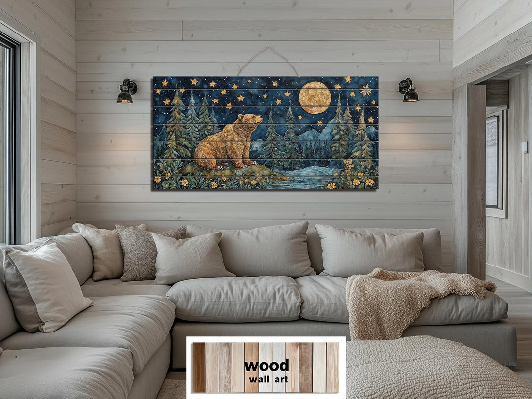 Rustic wood wall art featuring a bear under a full moon and stars above a neutral sectional sofa.