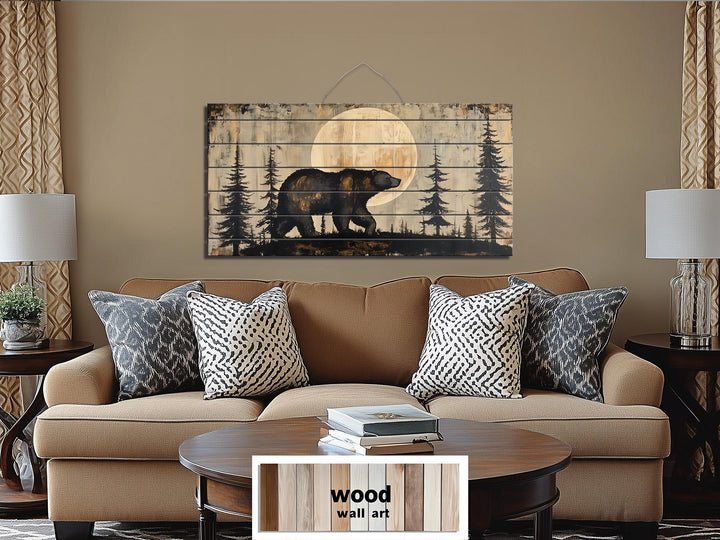 Rustic wood wall art featuring a bear walking through a forest under a full moon.