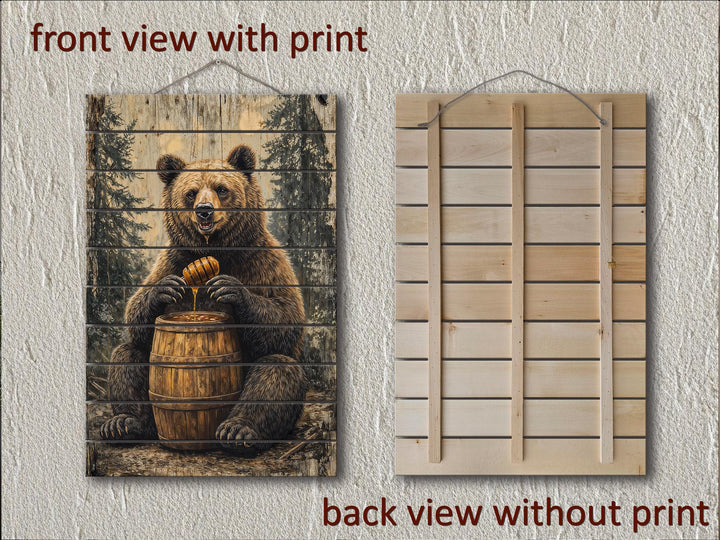 Rustic bear with honey barrel wall art printed on distressed wood planks with a hanging rope.