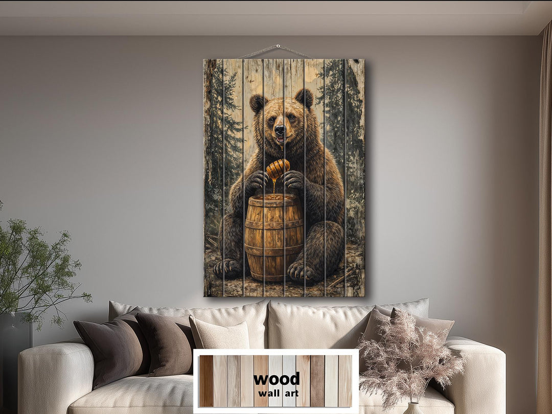Vertical wood wall art featuring a bear with a honey barrel in a rustic cabin setting.