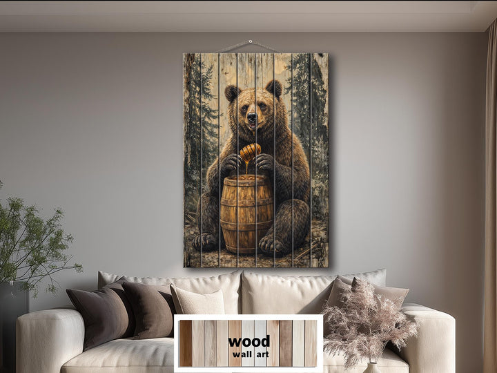 Vertical wood wall art featuring a bear with a honey barrel in a rustic cabin setting.