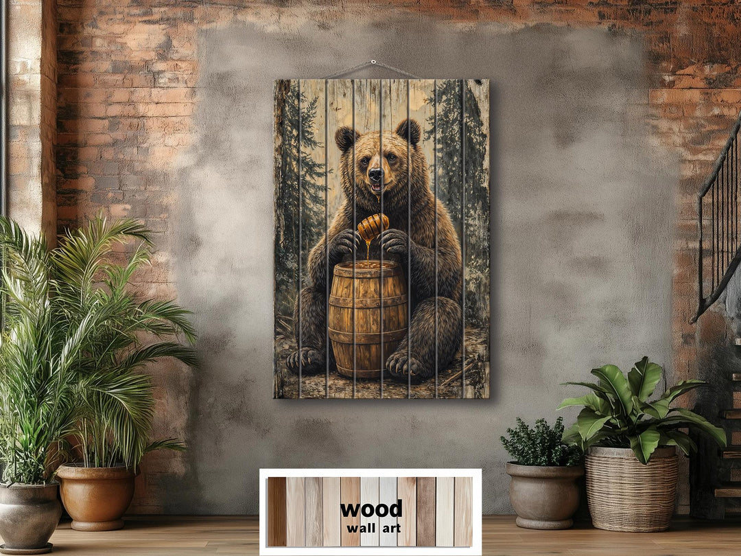 Vertical wood wall art featuring a bear with a honey barrel in a rustic cabin setting.