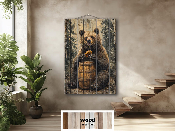 Vertical wood wall art featuring a bear with a honey barrel in a rustic cabin setting.