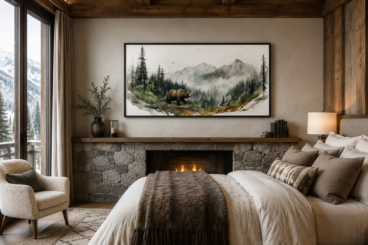 Bear in the forest mountain landscape wall art above a stone fireplace in a rustic bedroom.